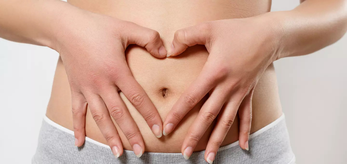 Woman holding stomach